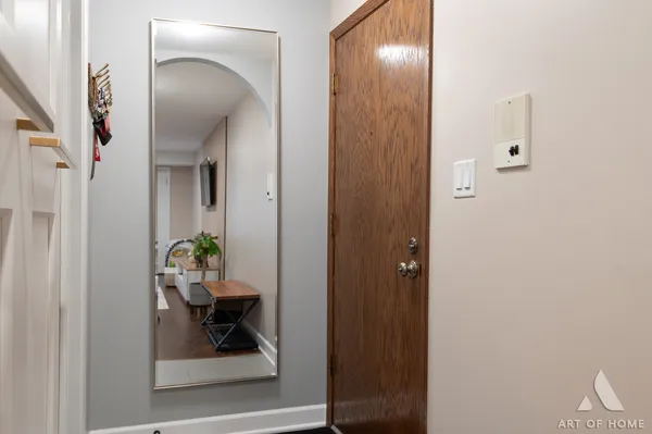 a view of hallway with livingroom and dining room