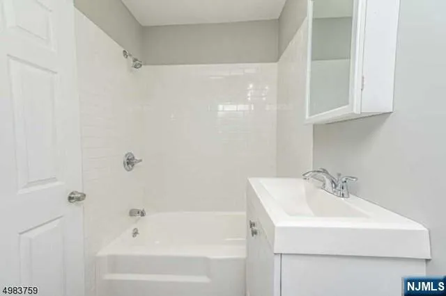 a bathroom with a sink and a bathtub