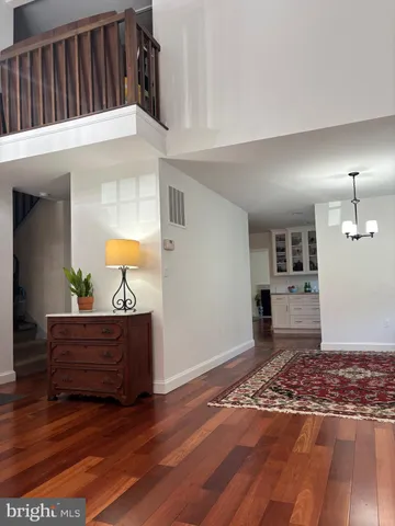 a view of a living room and wooden floor