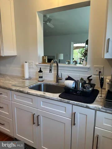 a kitchen with a sink and cabinets