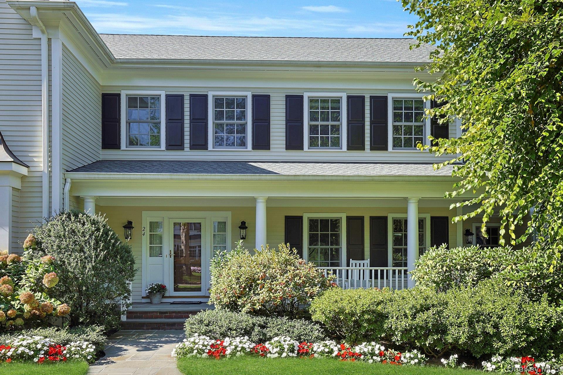 24 Fairview Road Scarsdale, NY 10583 - Photo 2 of 48 An inviting front porch and charming architectural details set the tone for the gracious living found throughout the home.