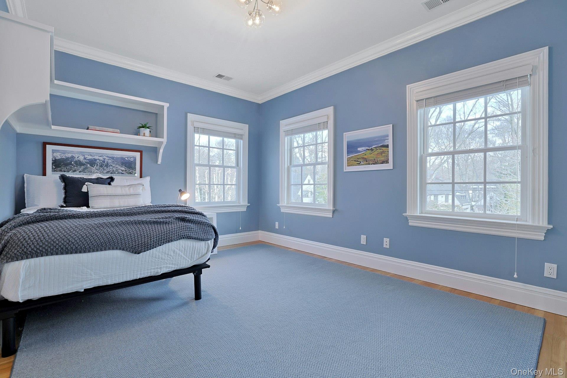 24 Fairview Road Scarsdale, NY 10583 - Photo 27 of 48 A spacious and sun-filled bedroom offering a fully outfitted closet and a beautifully updated private ensuite bath.
