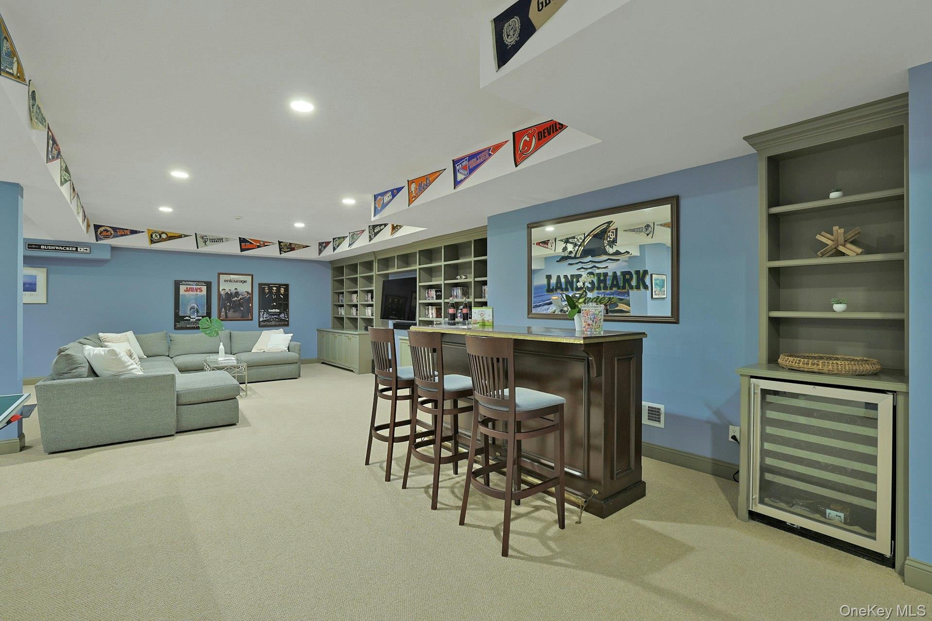 24 Fairview Road Scarsdale, NY 10583 - Photo 35 of 48 Stylish bar area with wine refrigerator and seating, ideal for hosting friends and family.