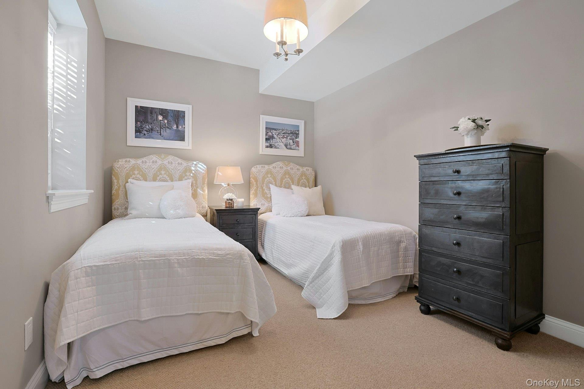 24 Fairview Road Scarsdale, NY 10583 - Photo 36 of 48 A bright and welcoming lower-level guest bedroom, ideal for overnight guests, au pair, or multigenerational living.