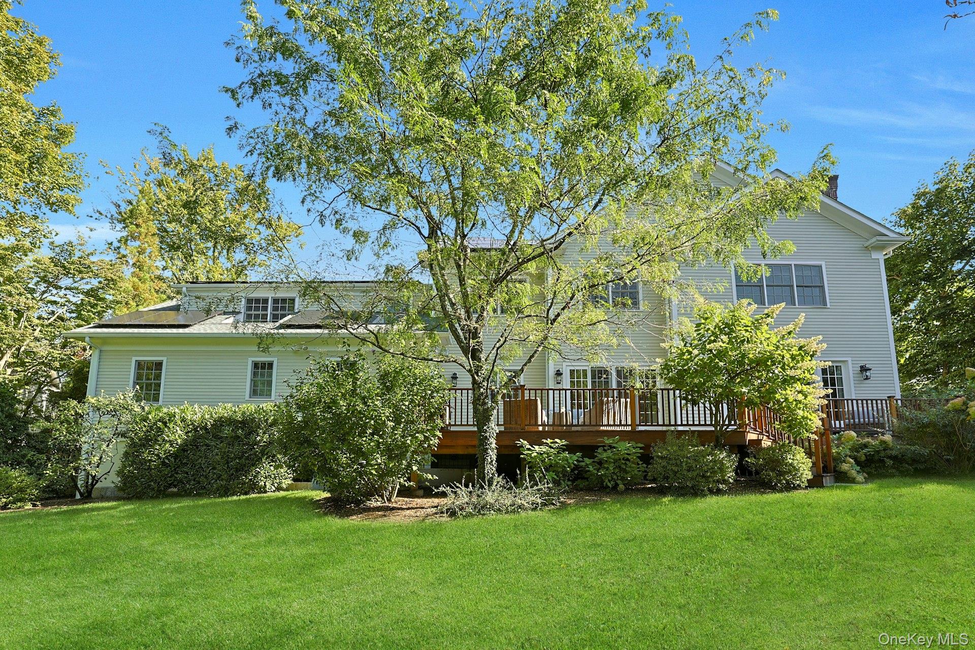 24 Fairview Road Scarsdale, NY 10583 - Photo 38 of 48 A fabulous, level backyard with a beautiful mahogany deck—perfect for outdoor dining, play, and relaxing in total privacy.