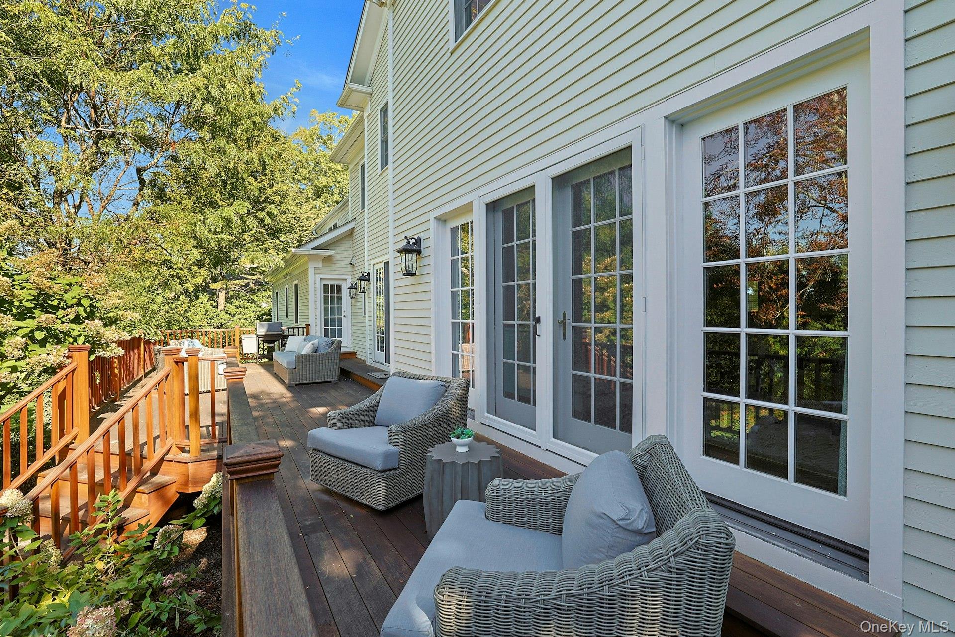 24 Fairview Road Scarsdale, NY 10583 - Photo 40 of 48 Another view showcases the seamless connection from the home’s main living spaces to this inviting outdoor retreat.