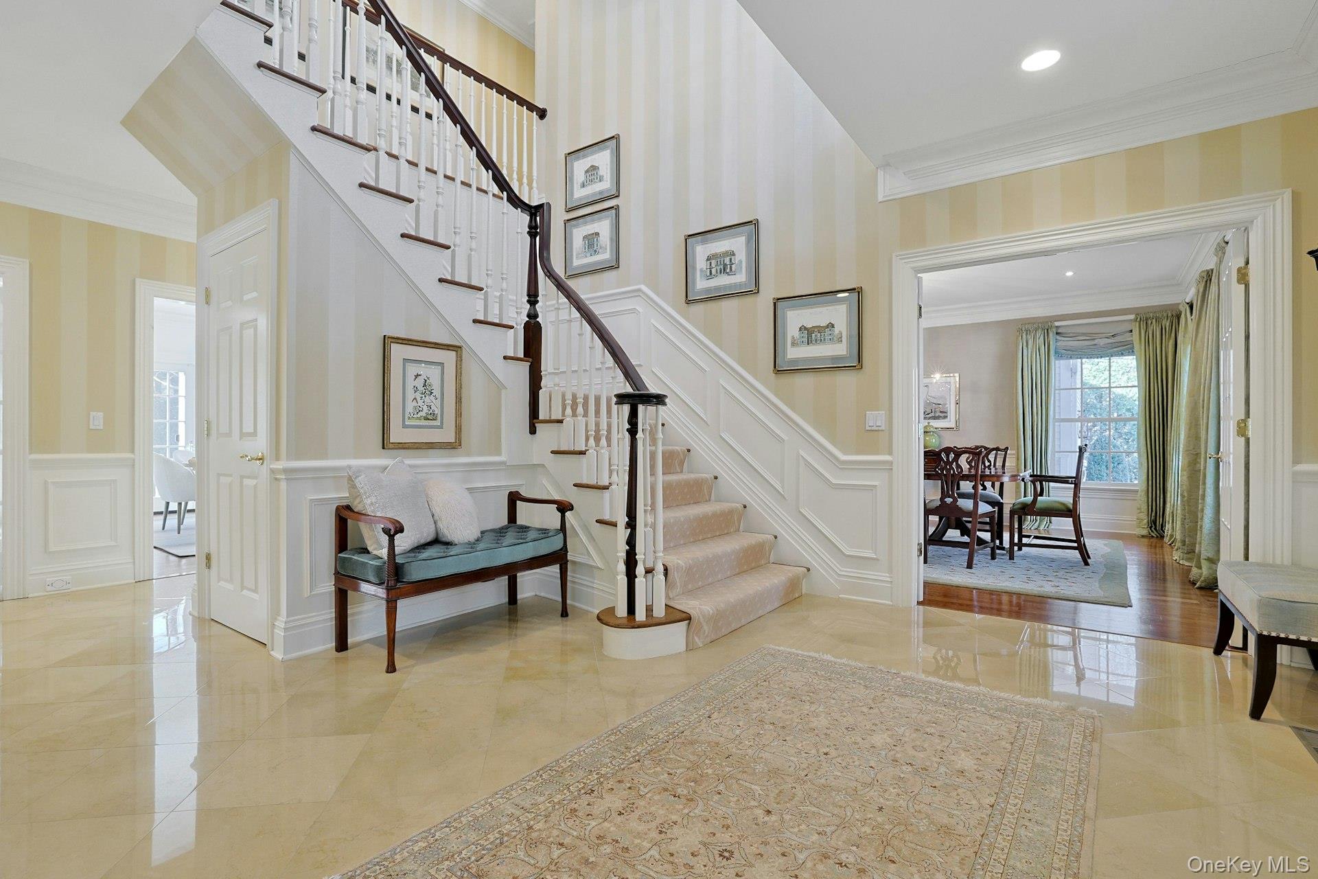24 Fairview Road Scarsdale, NY 10583 - Photo 4 of 48 Elegant marble floors, classic millwork, and an open, light-filled layout define this impressive entry.