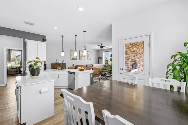 a view of yard with swimming pool and seating