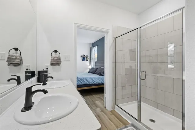 a bedroom with furniture and a flat screen tv