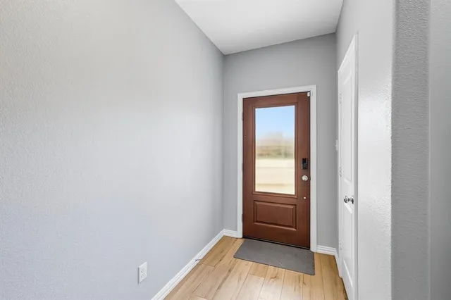 a view of an empty room and window