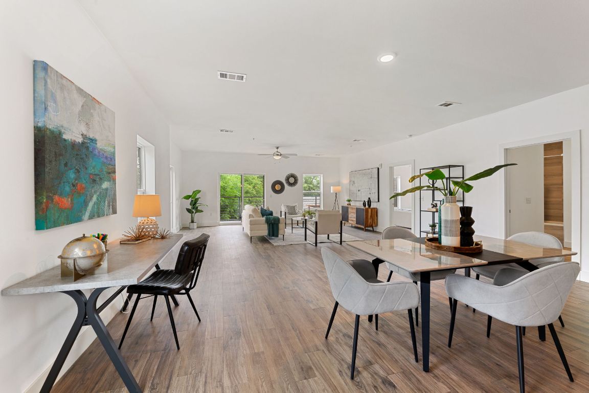 6444 Burnet Road, Unit 204 Austin, TX 78757 - Photo 11 of 36 a view of a dining room with furniture window and wooden floor