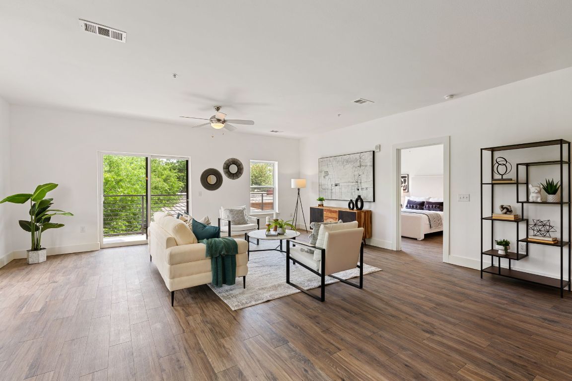 6444 Burnet Road, Unit 204 Austin, TX 78757 - Photo 14 of 36 a living room with furniture and a large window