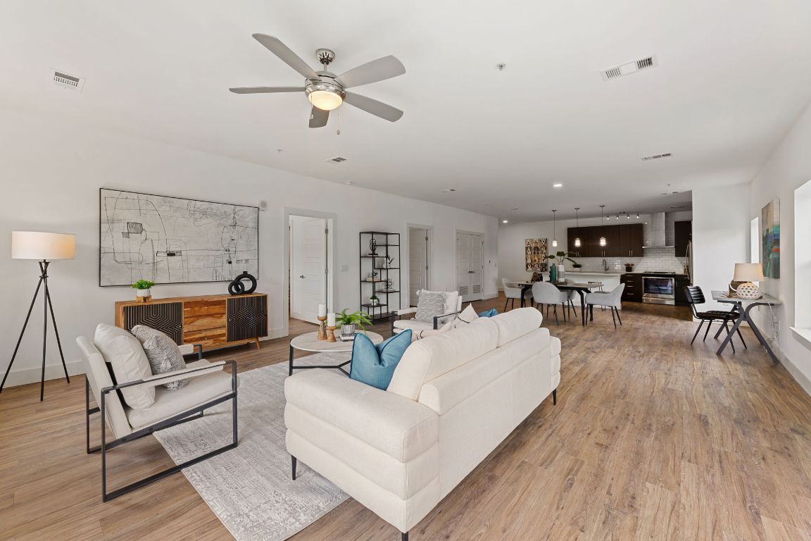 6444 Burnet Road, Unit 204 Austin, TX 78757 - Photo 15 of 36 a living room with furniture and wooden floor