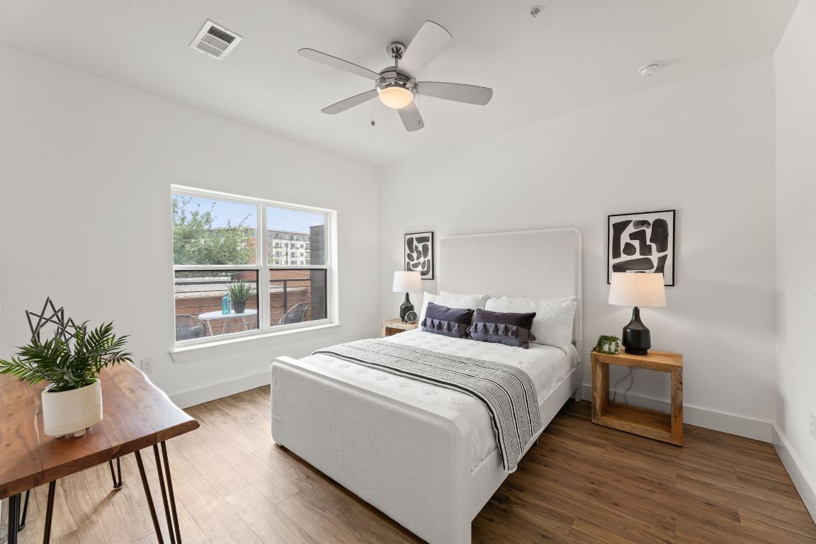 6444 Burnet Road, Unit 204 Austin, TX 78757 - Photo 17 of 36 a room with a bed and a table in it