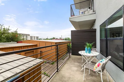 a view of a garden from a balcony