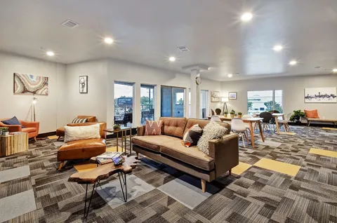 a view of a building with a yard