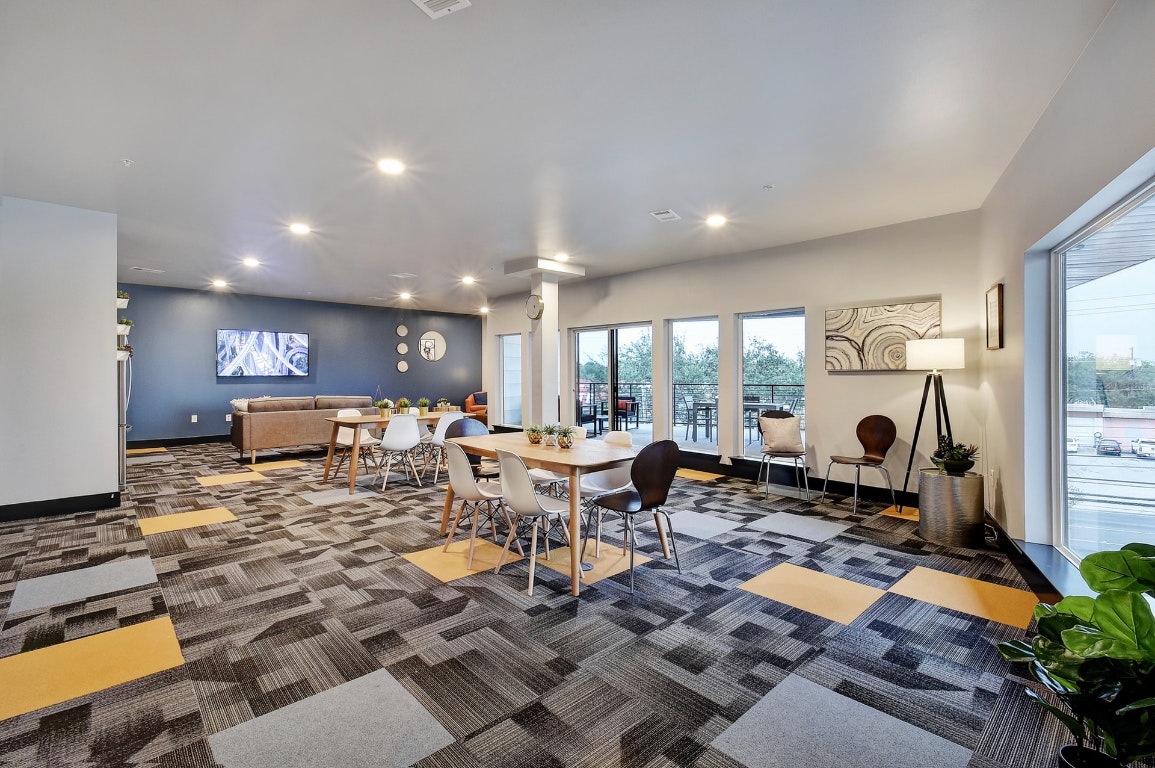 6444 Burnet Road, Unit 204 Austin, TX 78757 - Photo 34 of 36 a living room with lots of furniture and a fireplace
