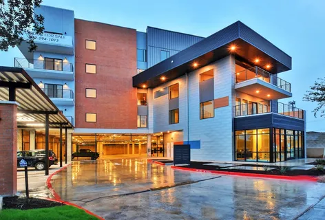 a view of a building with sitting area