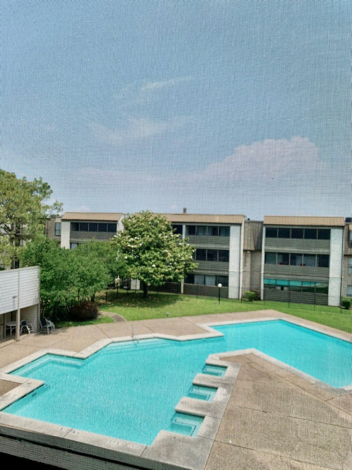 3055 Walnut Bend Lane, Unit 36 Houston, TX 77042 - Photo 15 of 16 a view of a swimming pool with an outdoor seating and a yard