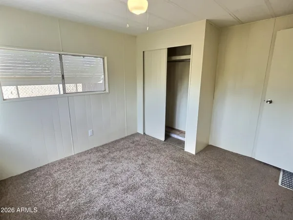 a view of an empty room and window