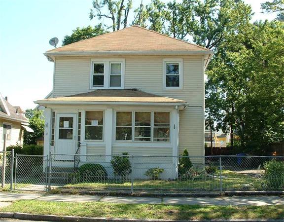 61 Mooreland Street Springfield, MA 01104 - Photo 1 of 8 a front view of a house with a garden