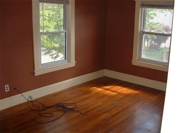 61 Mooreland Street Springfield, MA 01104 - Photo 6 of 8 a view of a room with wooden floor and a window