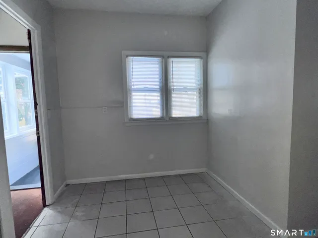 a kitchen with granite countertop cabinets and steel stove top oven