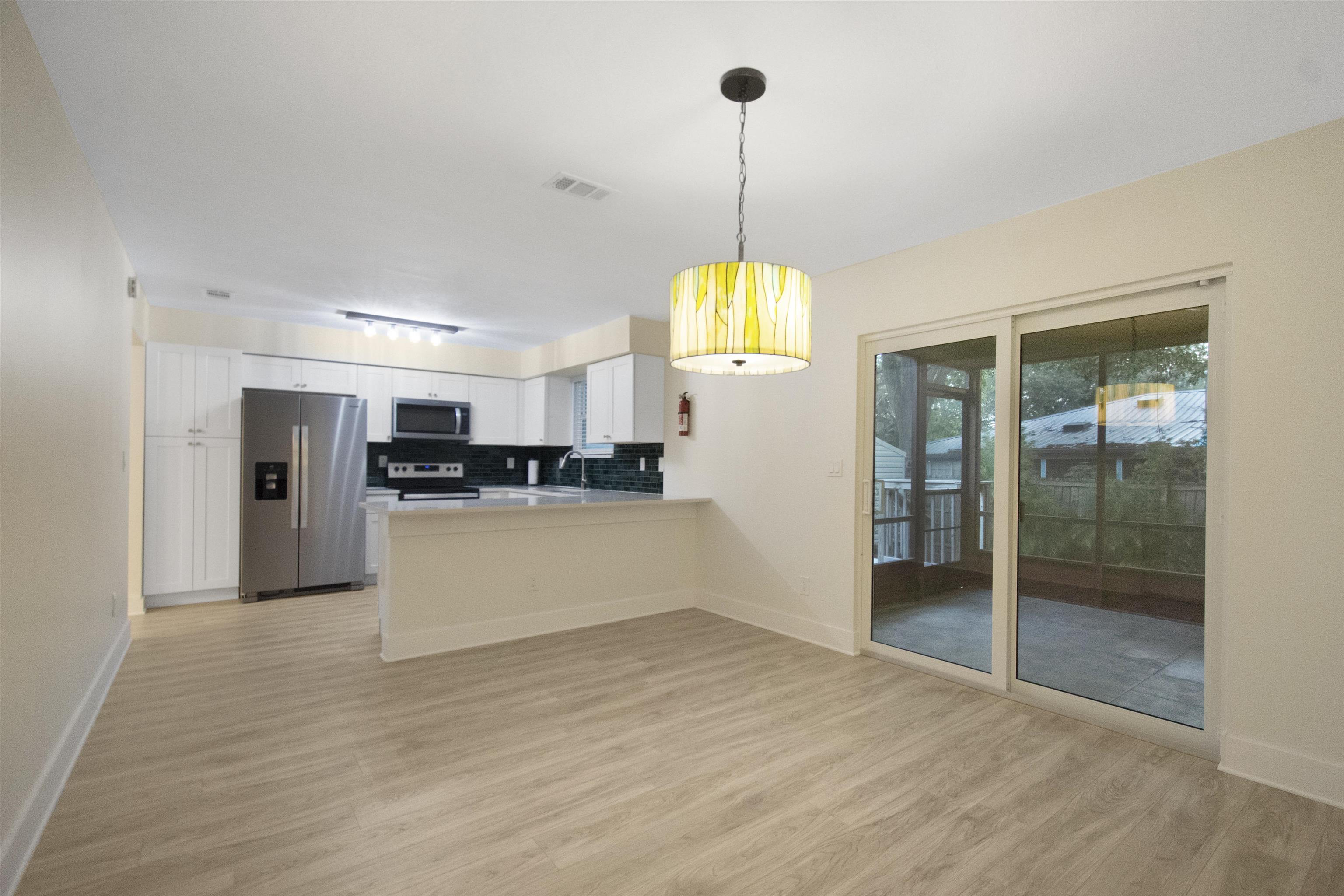 209 Jasmine Road St. Augustine, FL 32086 - Photo 11 of 25 a view of an empty room and kitchen view