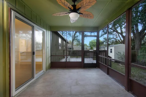 a view of an empty room with a balcony