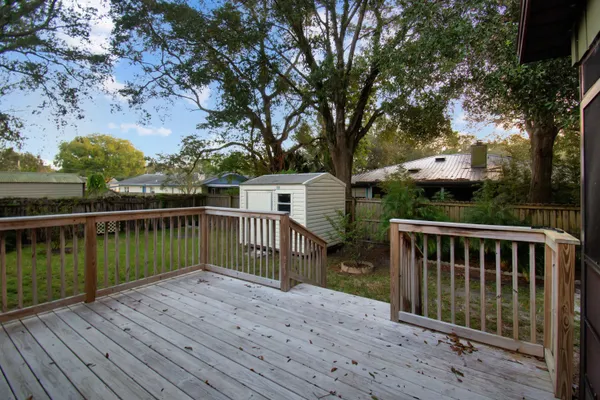 a view of deck with mountain view and wooden floor