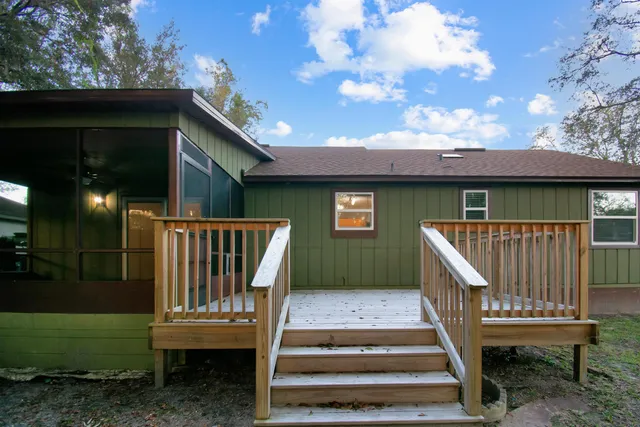 a view of a deck with wooden floor and fence