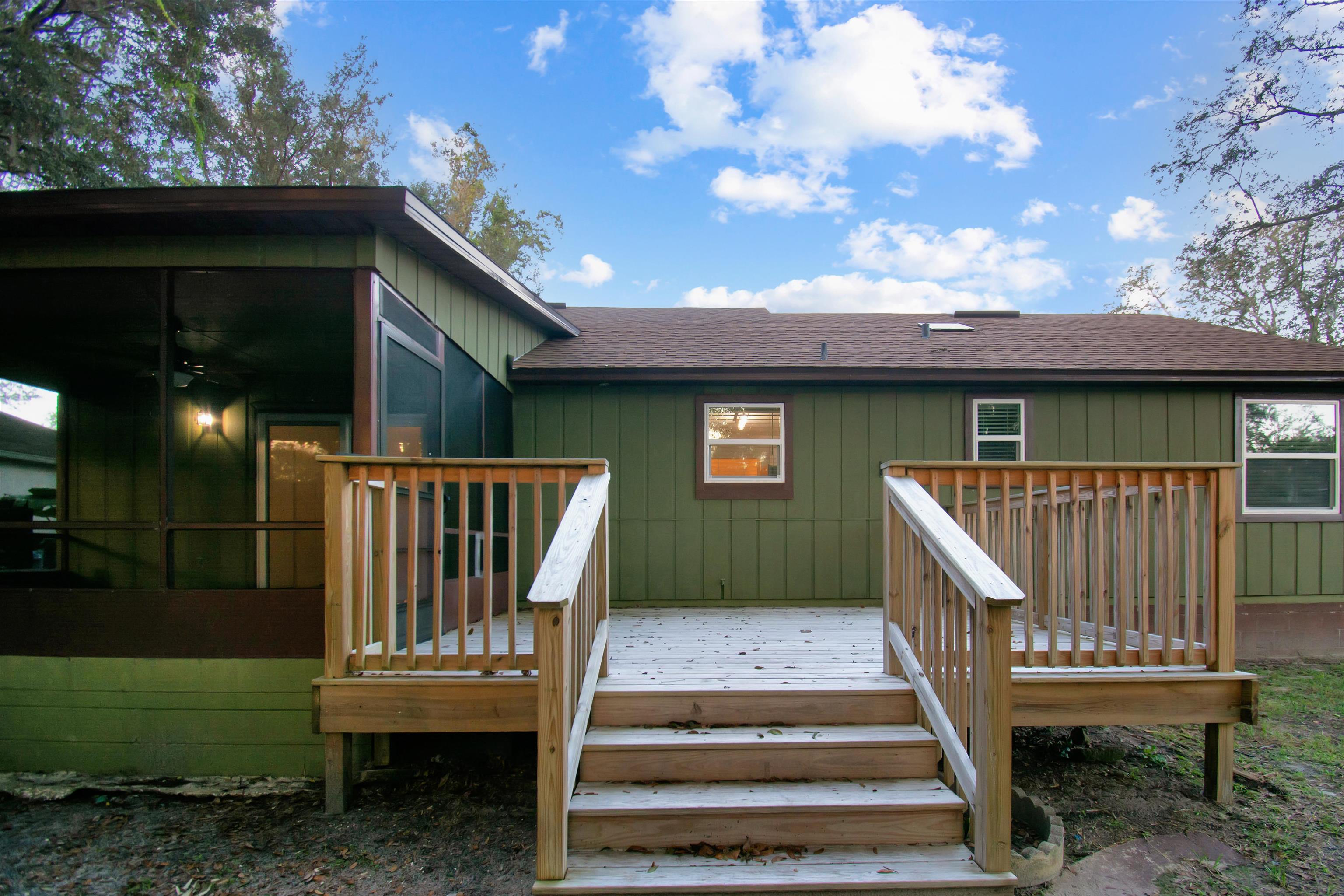 209 Jasmine Road St. Augustine, FL 32086 - Photo 21 of 25 a view of a deck with wooden floor and fence