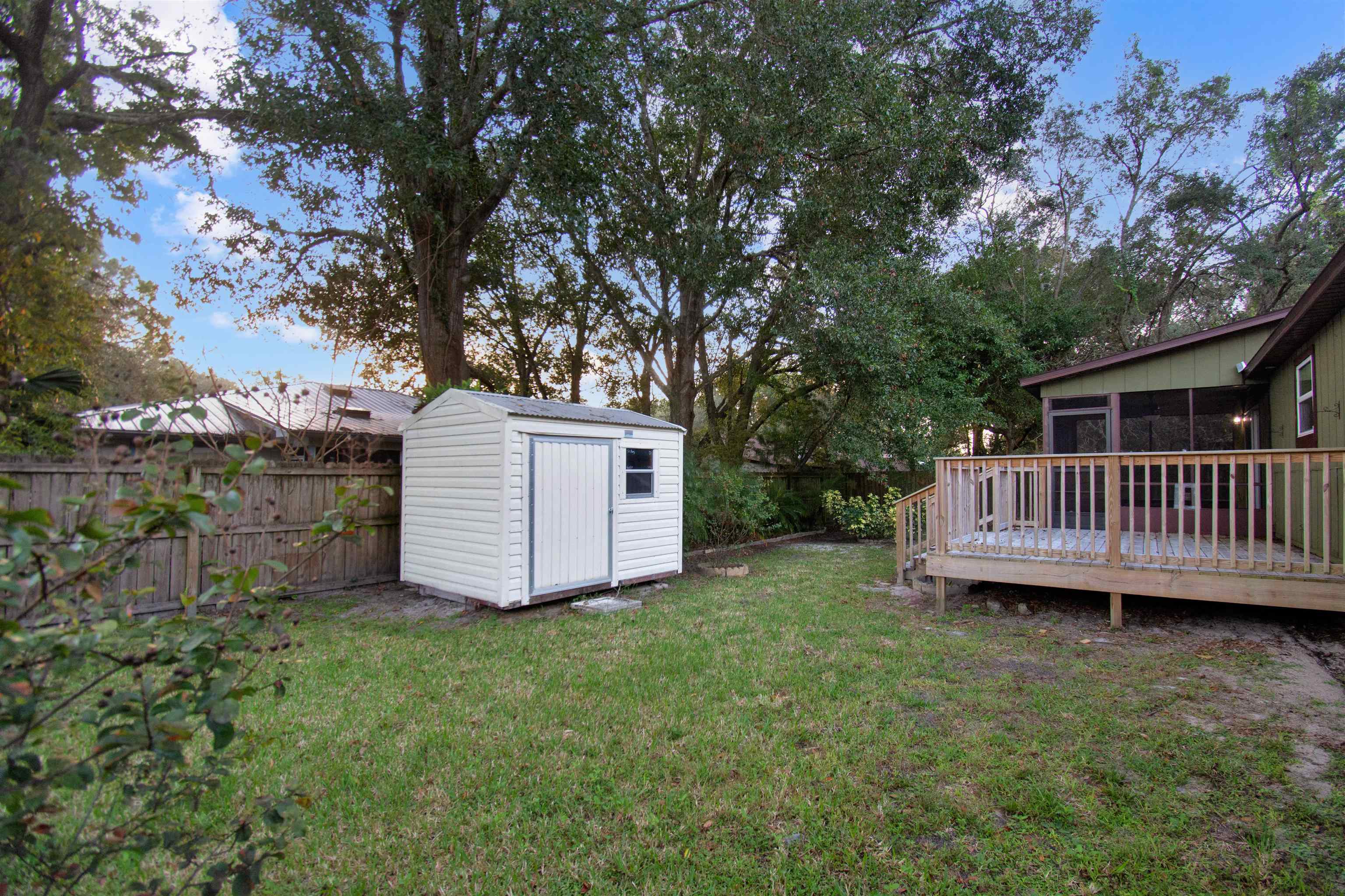 209 Jasmine Road St. Augustine, FL 32086 - Photo 24 of 25 a view of a house with a yard and a large tree