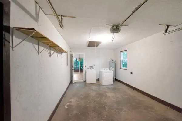 a view of a big room with closet and windows