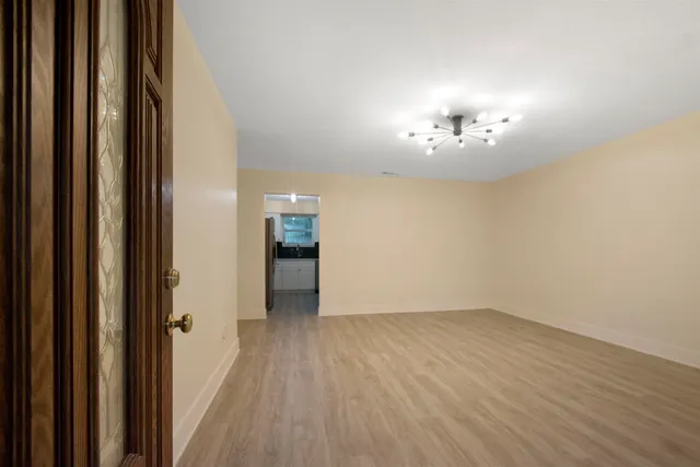 a view of a room with a hardwood