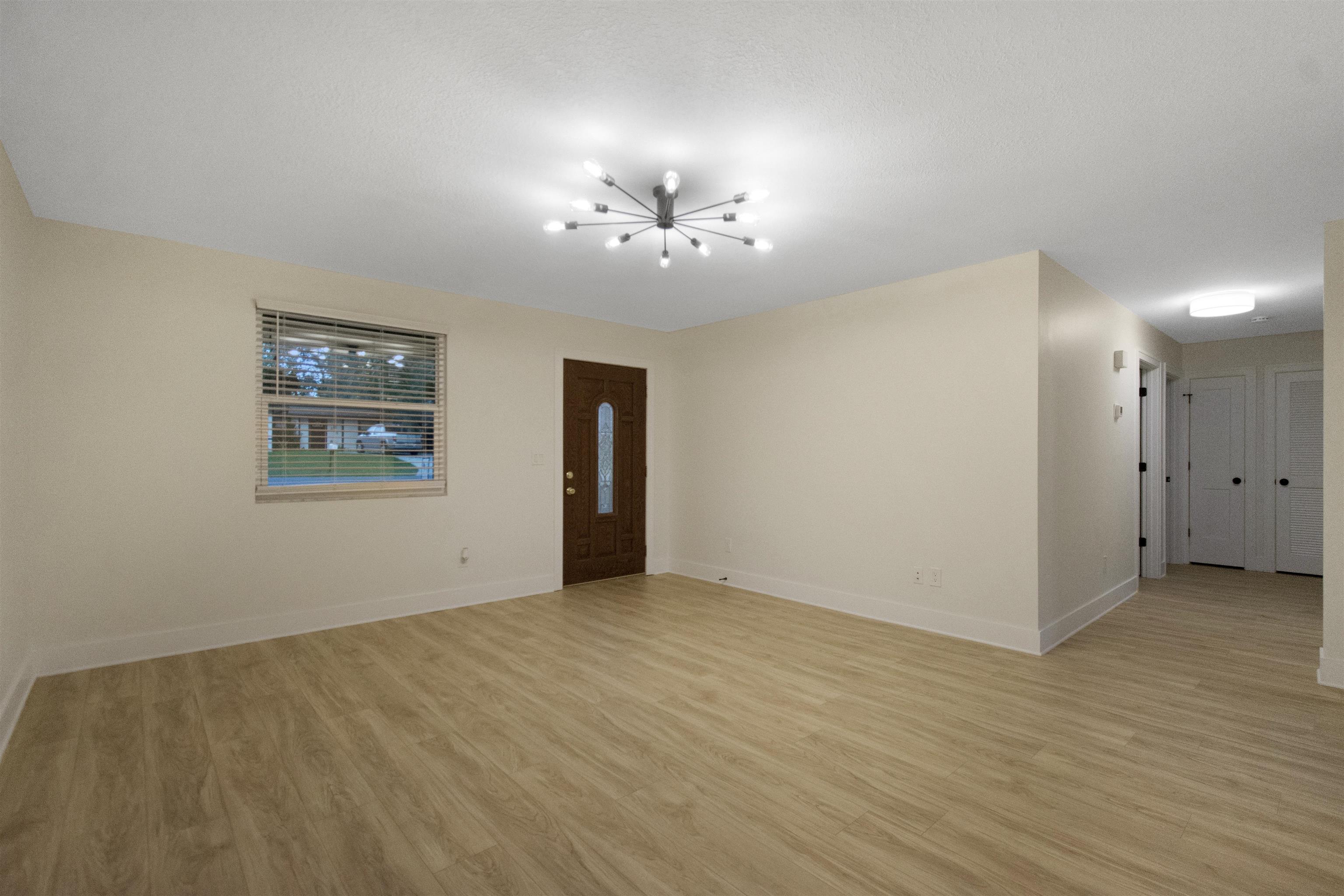 209 Jasmine Road St. Augustine, FL 32086 - Photo 6 of 25 a view of an empty room with a window