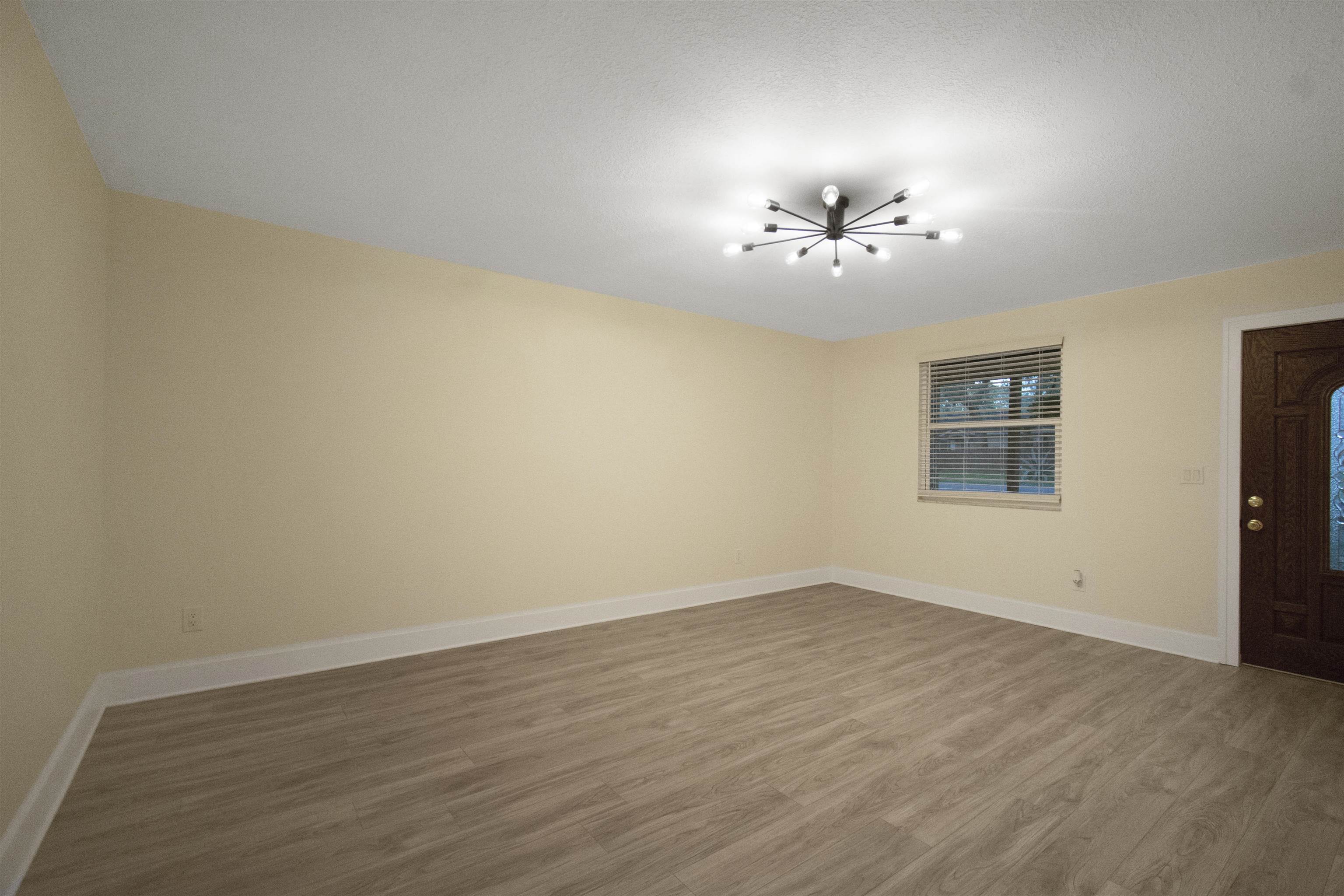 209 Jasmine Road St. Augustine, FL 32086 - Photo 7 of 25 a view of a room with an empty space and a ceiling fan