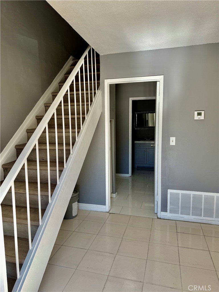 470 West Jackson Street Rialto, CA 92376 - Photo 14 of 28 a view of an entryway with staircase