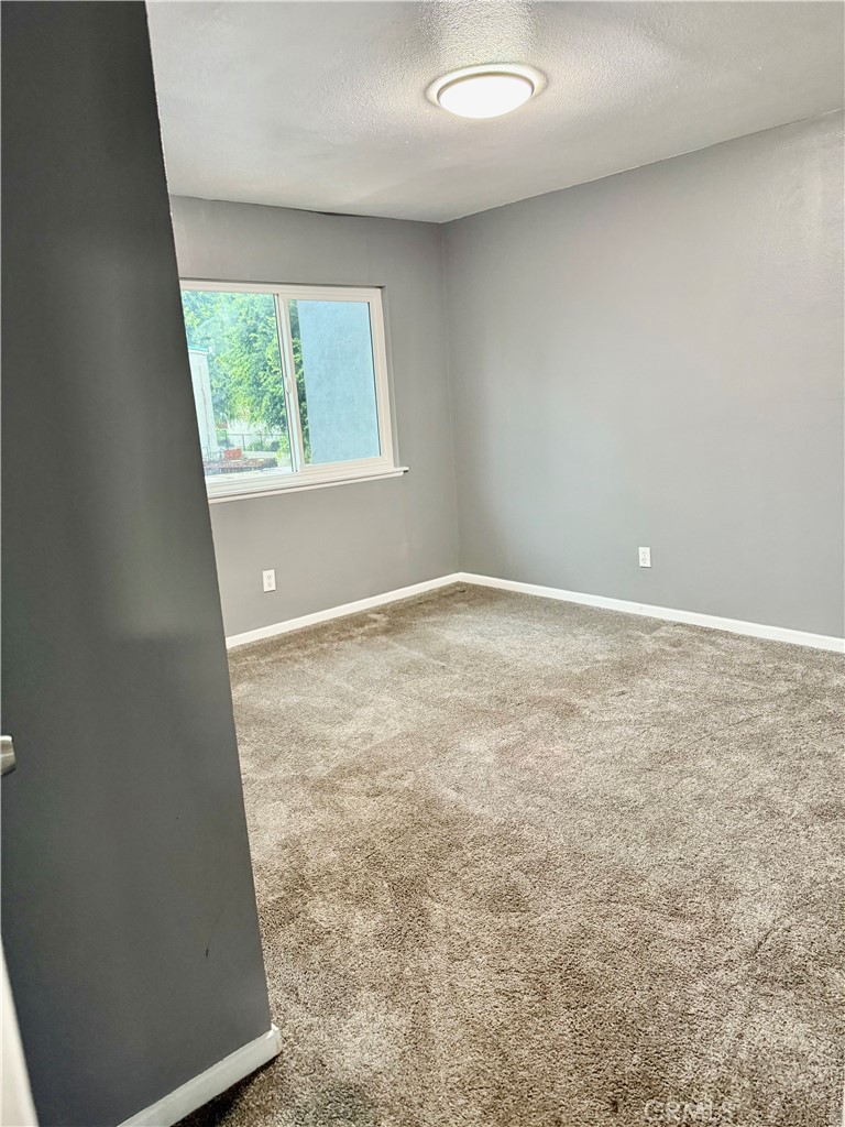 470 West Jackson Street Rialto, CA 92376 - Photo 19 of 28 an empty room with a window