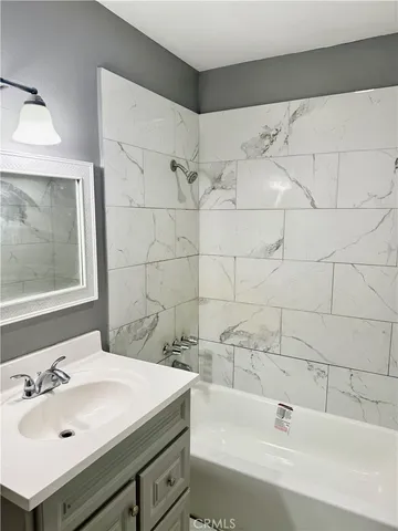 a bathroom with a sink and a bathtub