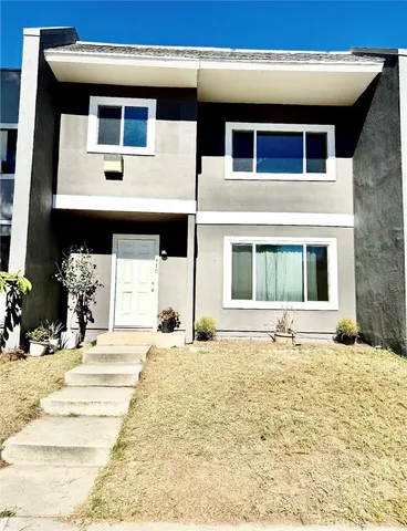 a view of a building with a yard