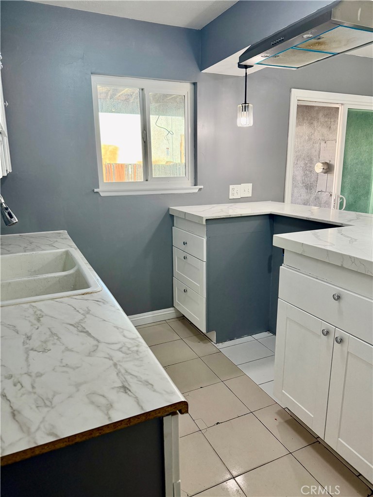470 West Jackson Street Rialto, CA 92376 - Photo 10 of 28 a bathroom with a sink vanity and a mirror