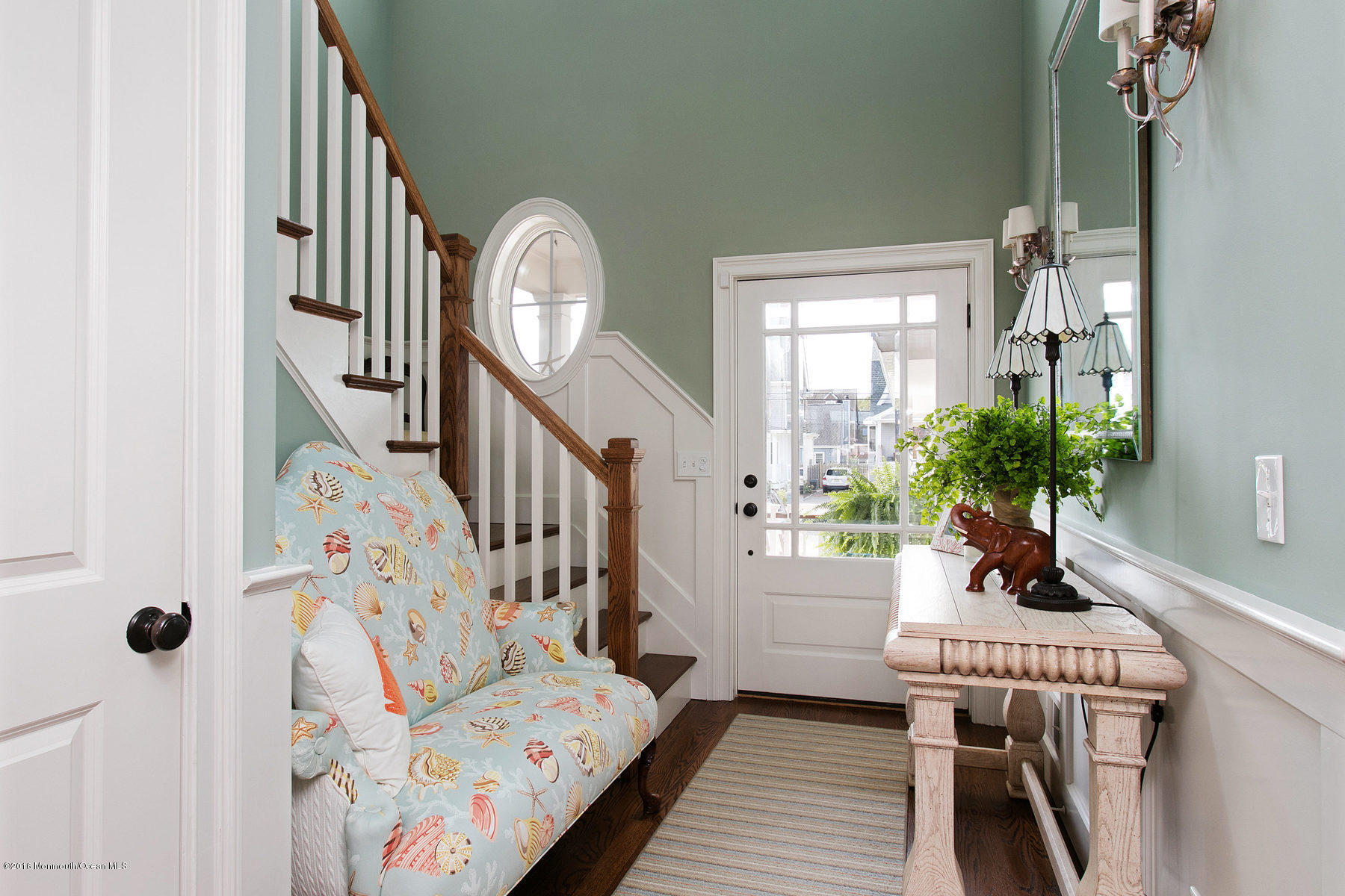 96 Bridge Avenue Bay Head, NJ 08742 - Photo 3 of 45 a living room with furniture and a chandelier