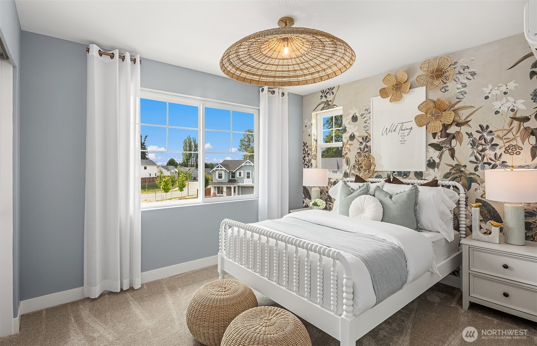 20347 90th Drive Northeast, Unit A Bothell, WA 98011 - Photo 13 of 18 a bedroom with a bed and a chandelier