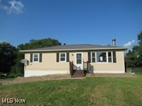 6439 Wadsworth Road Medina, OH 44256 - Photo 1 of 14 Single story home with a front yard and stucco siding