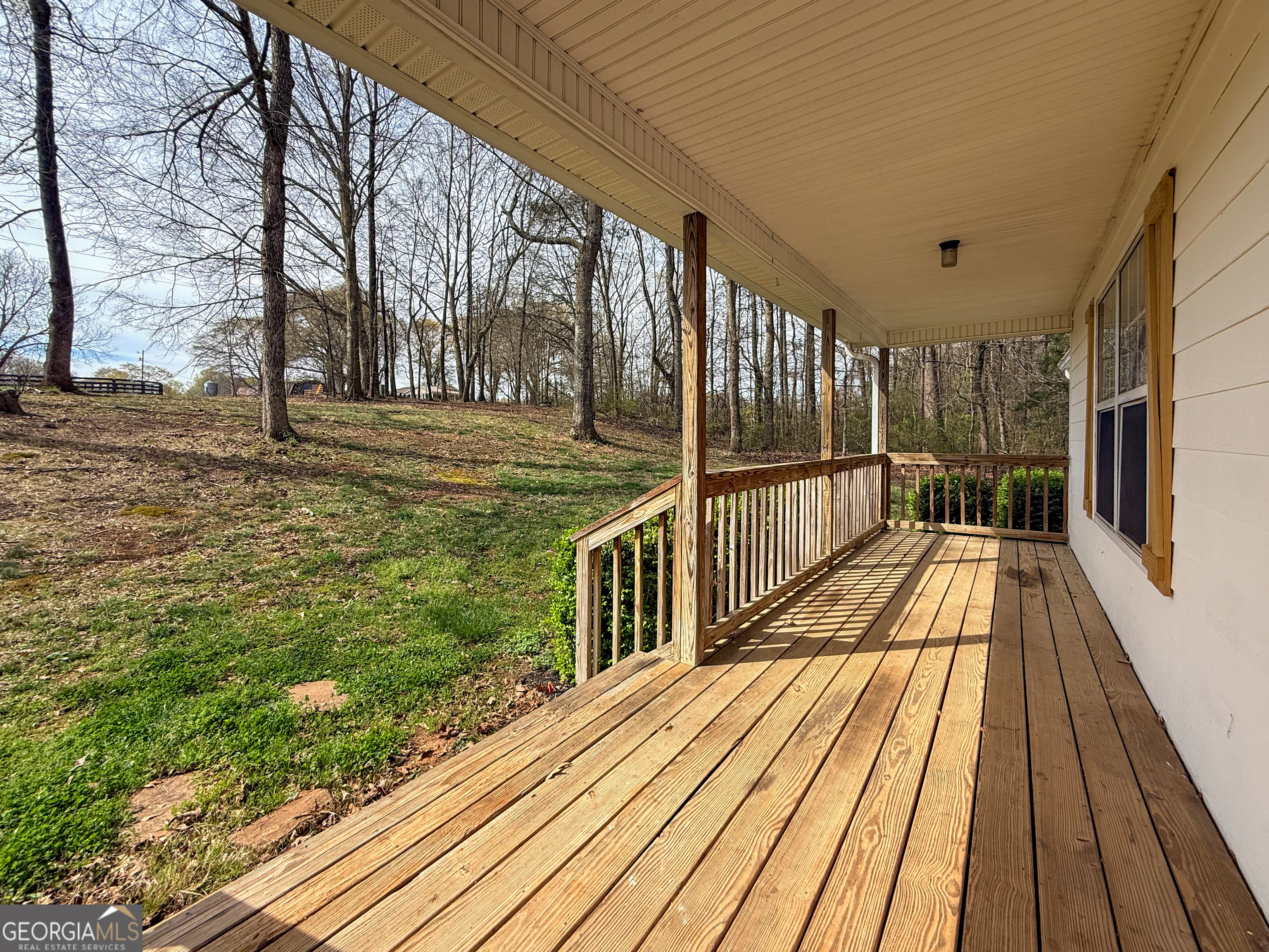 1492 Highway 198 Carnesville, GA 30521 - Photo 3 of 25 a view of balcony with wooden floor and fence