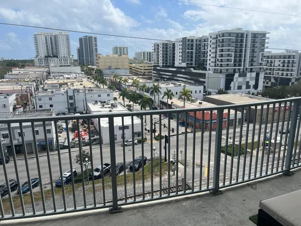 a view of a balcony with city view