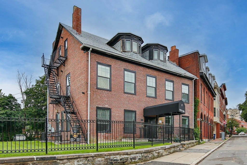 27 Dudley Street Boston, MA 02119 - Photo 42 of 42 a front view of a house with garden
