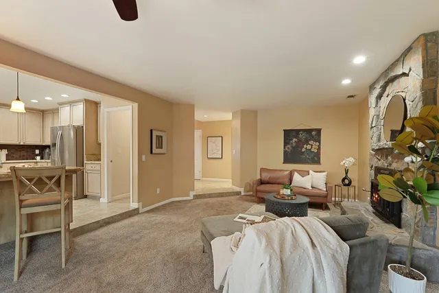 a view of staircase with lots of frames on wall and a baby crib