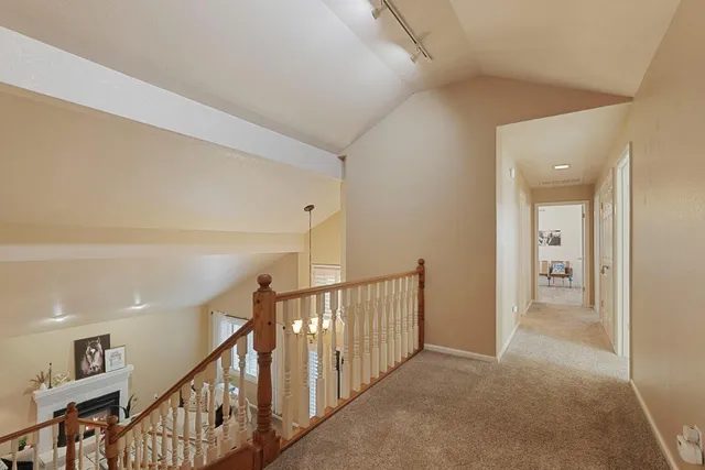 a spacious bathroom with a double vanity sink a mirror and a bathtub